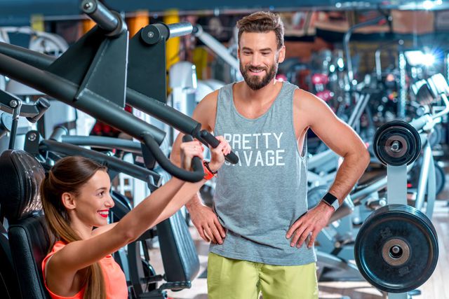 Personal trainer with woman